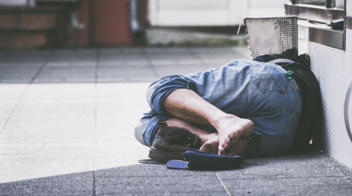 Homeless person on floor